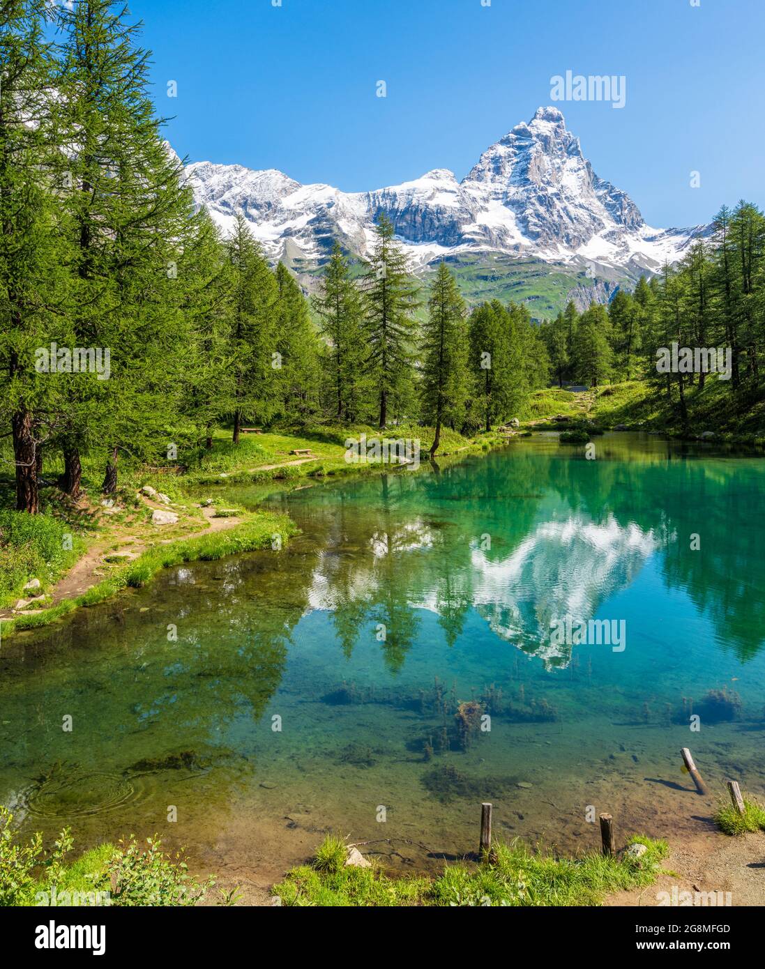 Idyllic morning view at the Blue Lake with the Matterhorn reflecting on the water, Valtournenche, Aosta Valley, Italy. Stock Photo