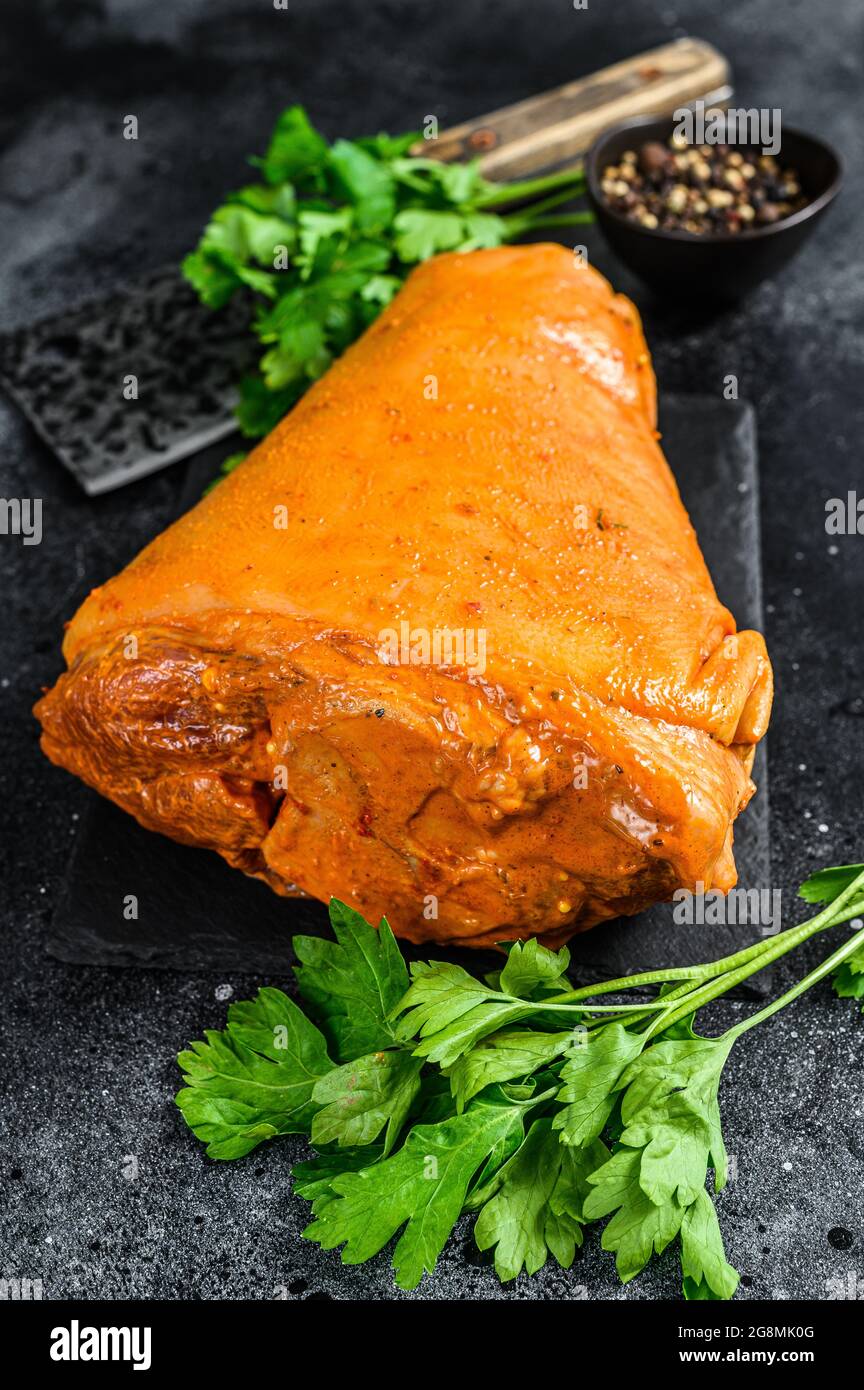 Raw marinated pork knuckle. Black background. Top view Stock Photo Alamy
