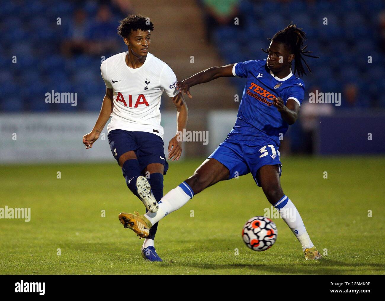 Tottenham Hotspur's Brooklyn Lyons-Foster and Colchester United’s Donell Thomas (right) battle for the ball during the pre-season friendly match at the JobServe Community Stadium, Colchester. Picture date: Wednesday July 21, 2021. Stock Photo