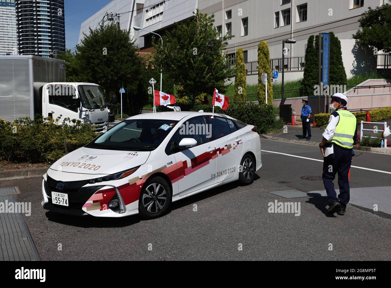 Tokyo, Japan. 21st July, 2021. Tokyo 2020 designated vehicle for the Canadian team arrives at the Olympic Village in Harumi.Usually the heart piece of Olympic Games, the Tokyo 2020 Olympic village in Harumi is secured behind tall metal fences with military and police on patrol duty and check points with roadblocks. Inside, athletes and other members of the Olympic teams have to adhere to strict protocols to minimize the risk of contracting Sars-CoV-2-Coronavirus. (Photo by Stanislav Kogiku/SOPA Images/Sipa USA) Credit: Sipa USA/Alamy Live News Stock Photo