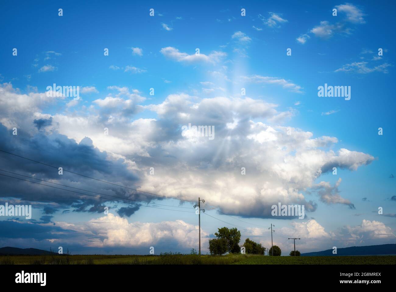 Panorama view on a moody cloudscape in the evening Stock Photo