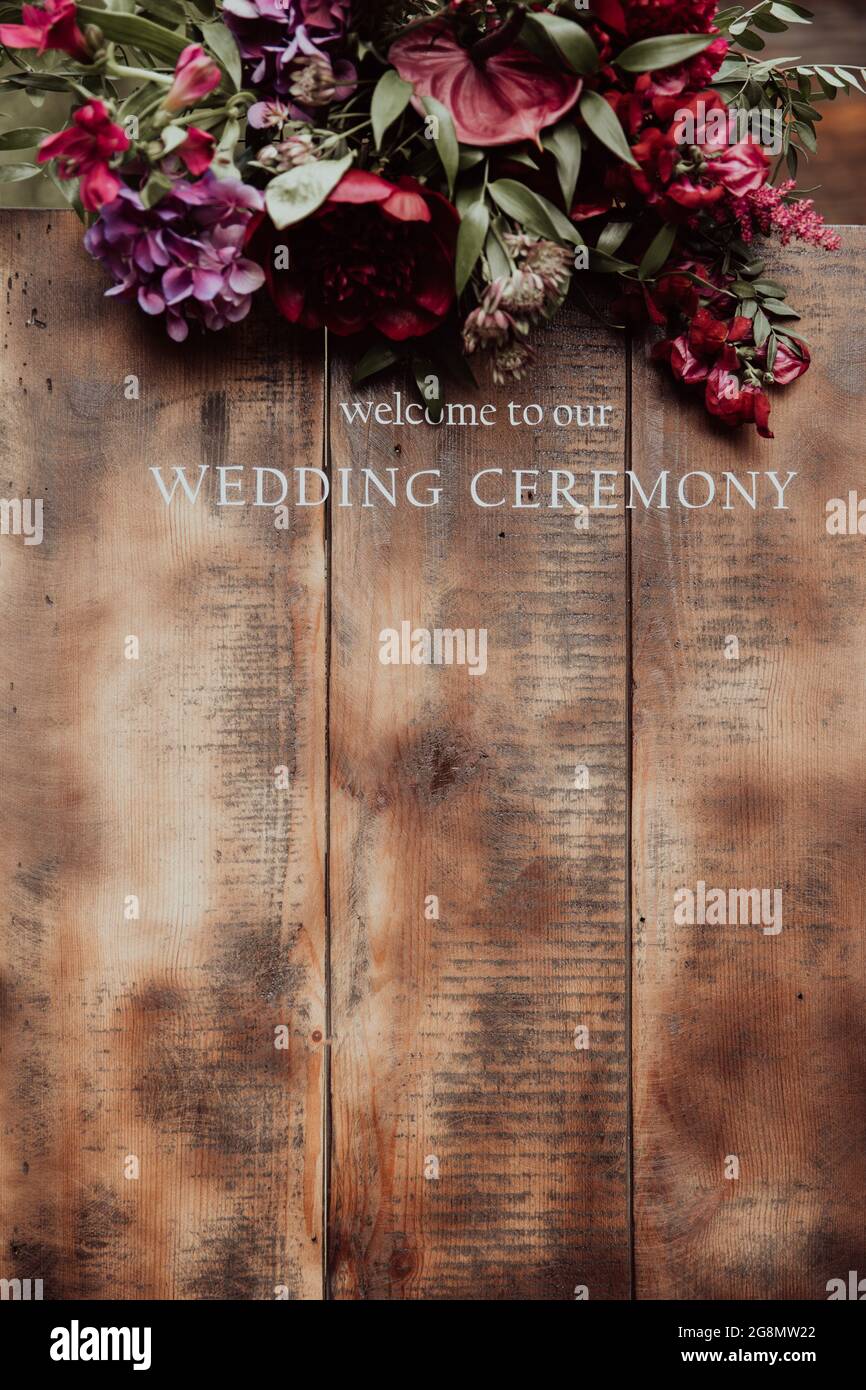 easel with wooden WELCOME TO OUR WEDDING sign in front of dunes Stock Photo  - Alamy