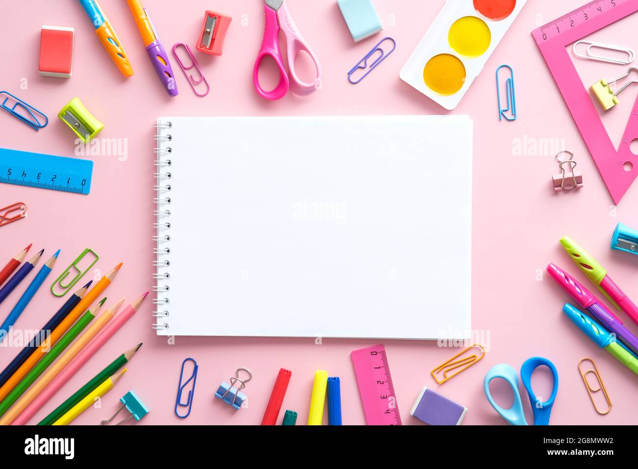 Premium Photo  School supplies in pink colors on a white background with a  place for an inscription preparation for school