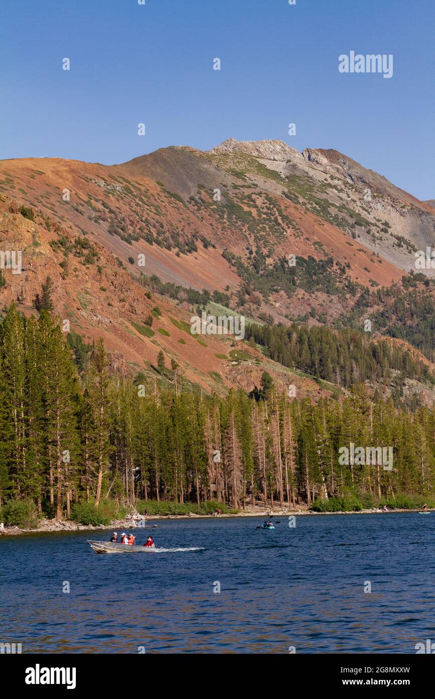 Family boating in Lake Mary in Mammoth Lakes CA Stock Photo