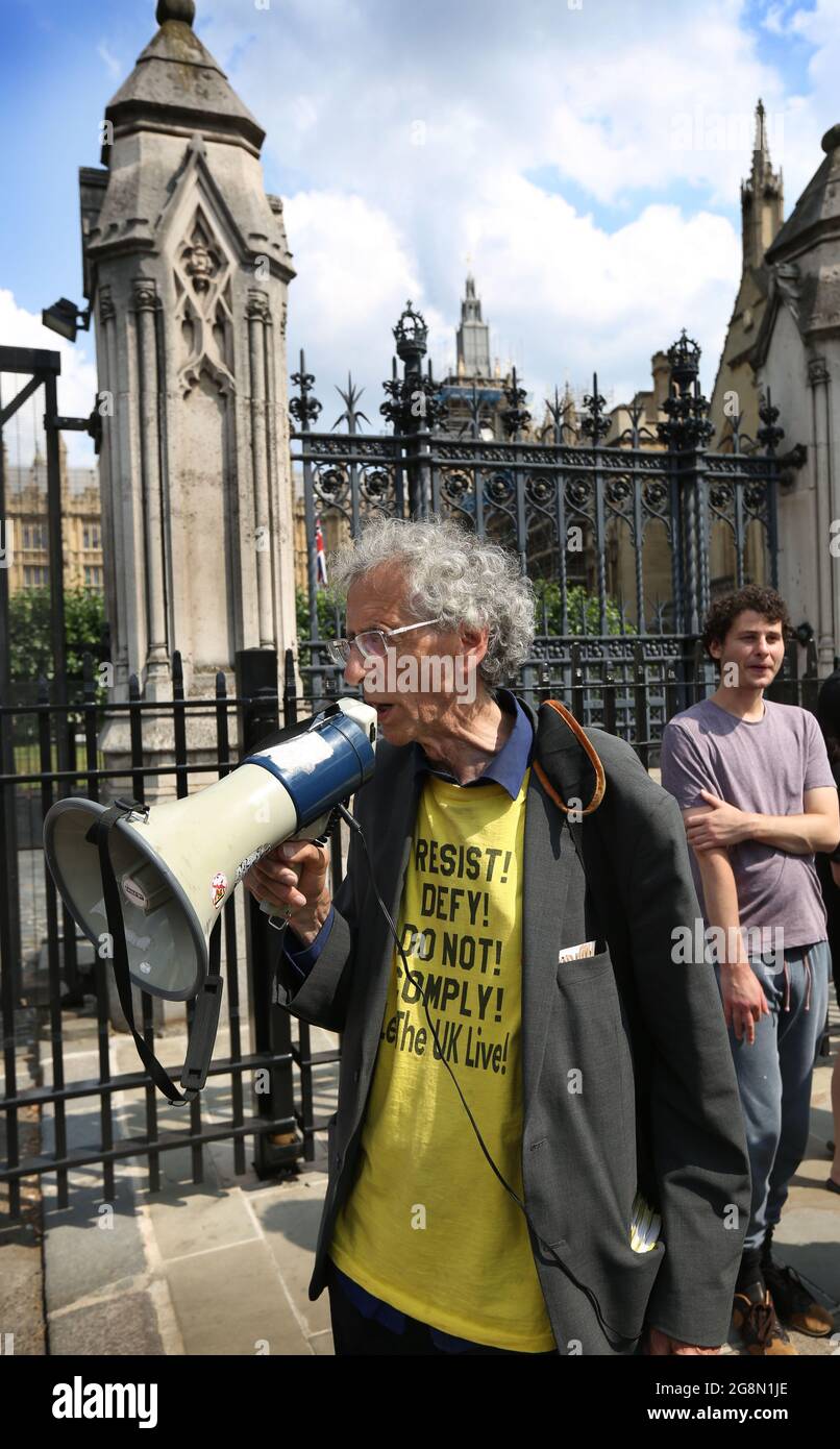 Piers Corbyn shouts through a megaphone, during the demonstration.English weather forecaster, businessman, activist, Piers Corbyn with other protesters met outside the House of Commons at Parliament Square to protest against Vaccine passports and other Coronavirus restrictions that he feels the public are being softened up to accept as the new normal. (Photo by Martin Pope / SOPA Images/Sipa USA) Stock Photo
