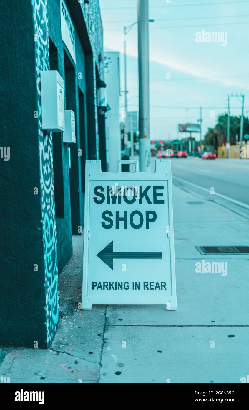 Closeup of a SMOKE SHOP signage on the sidewalk Stock Photo Alamy