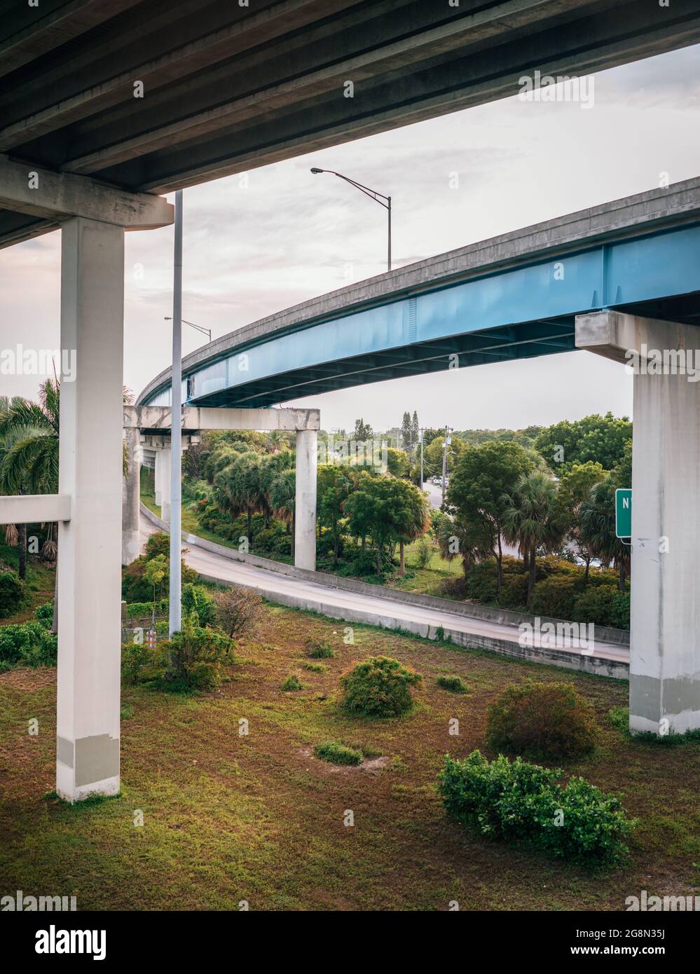 Empty freeway in between beautiful landscape below the skyway bridge ...