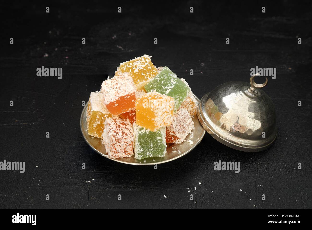 Turkish delight dessert in plate on black background Stock Photo Alamy