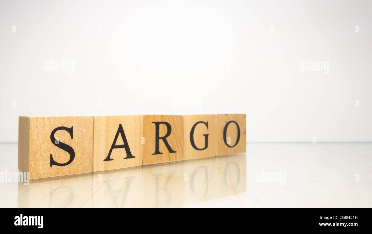 The name Sargo was created from wooden letter cubes. Seafood and food. close up. Stock Photo