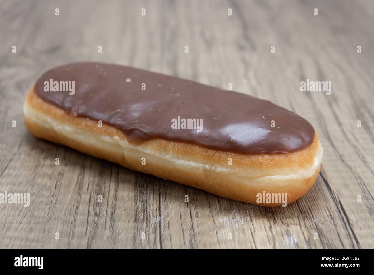 Chocolate bar donut is textured with glazed coating for a sweet treat