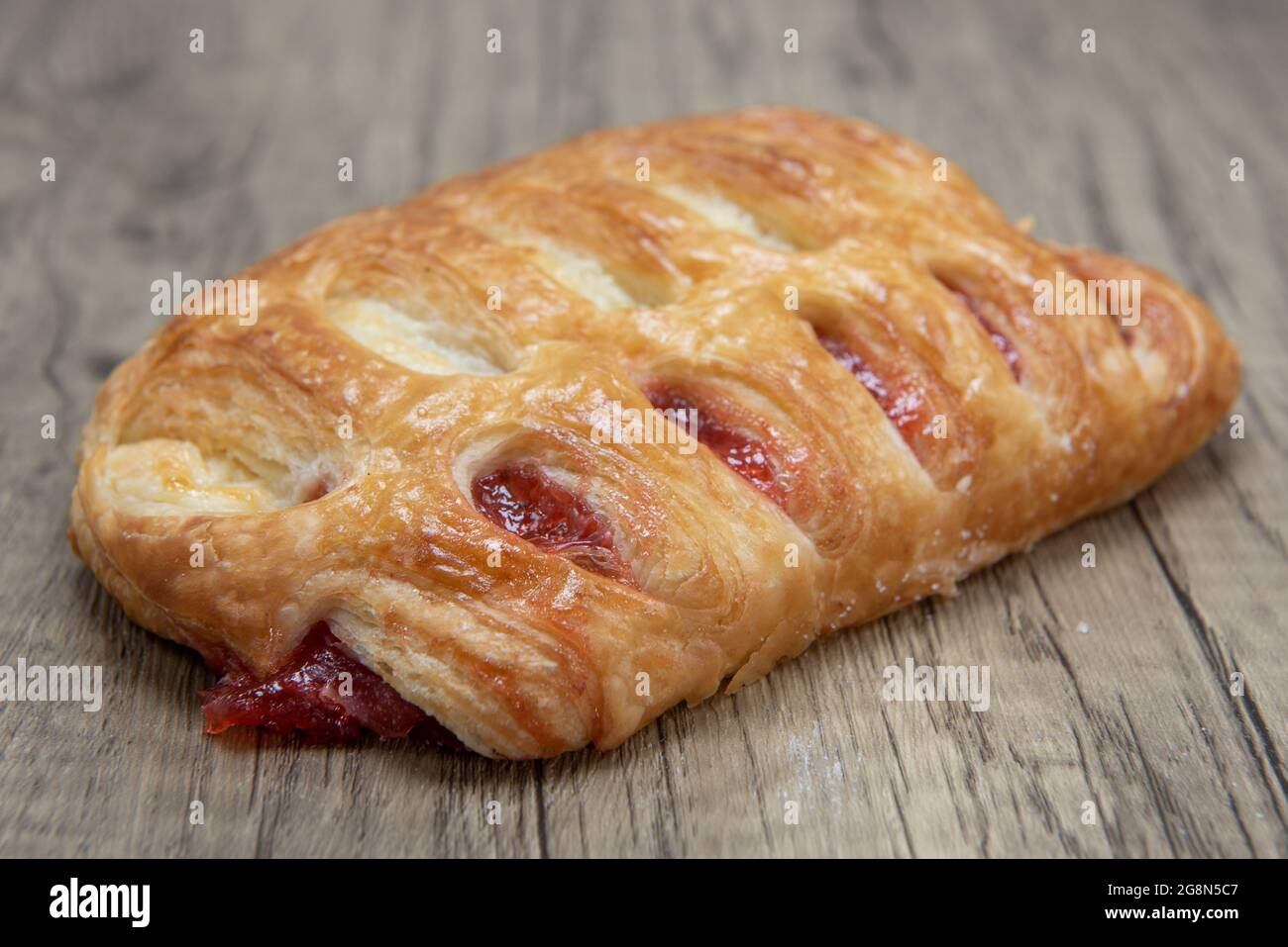 Ham and cheese croissant sandwich is textured with flakey crust for a breakfast treat delight. Stock Photo