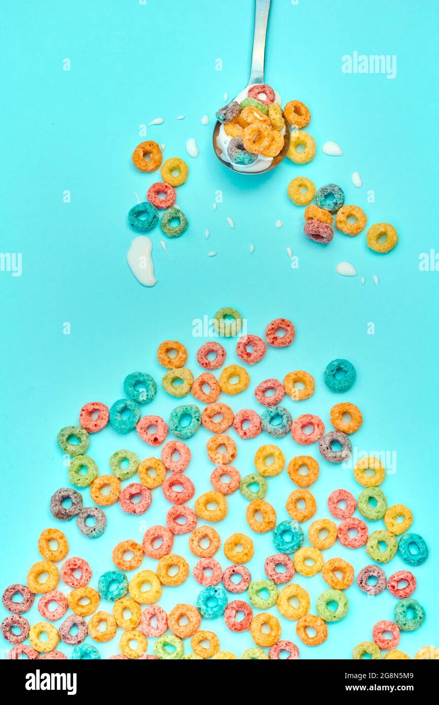 Colorful cereal on blue background Stock Photo - Alamy