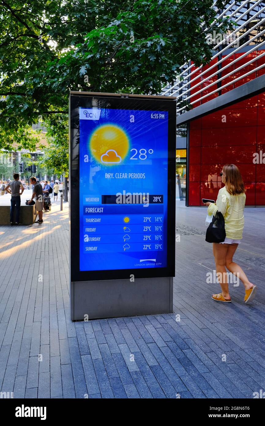 A digital advertising board displaying a weather forecast during a heatwave  in London when the Met Office issued an amber heat warning Stock Photo -  Alamy
