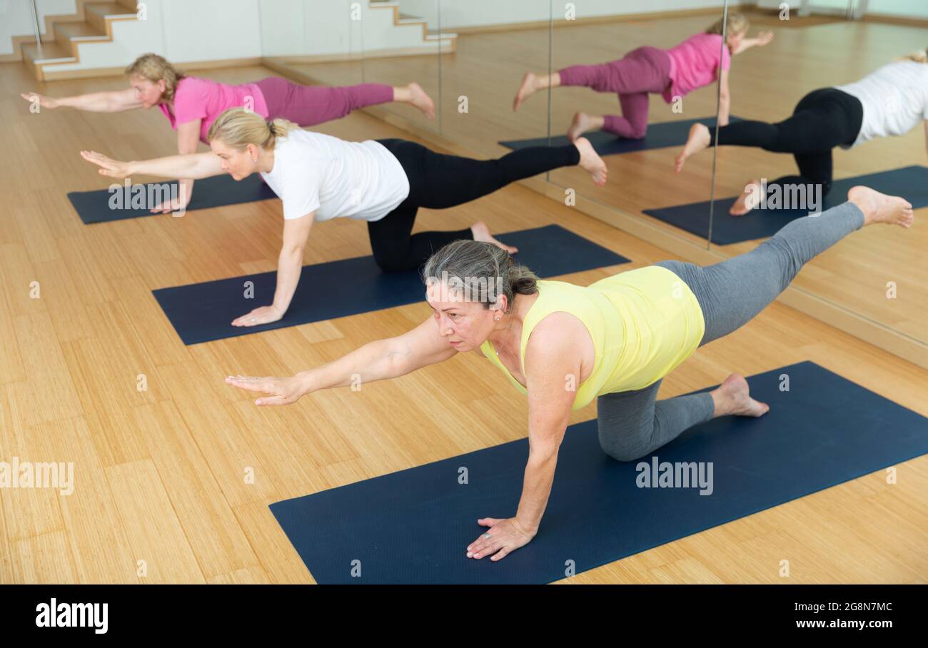 Professional Female Athlete Practicing Yoga Horizontal Balancing