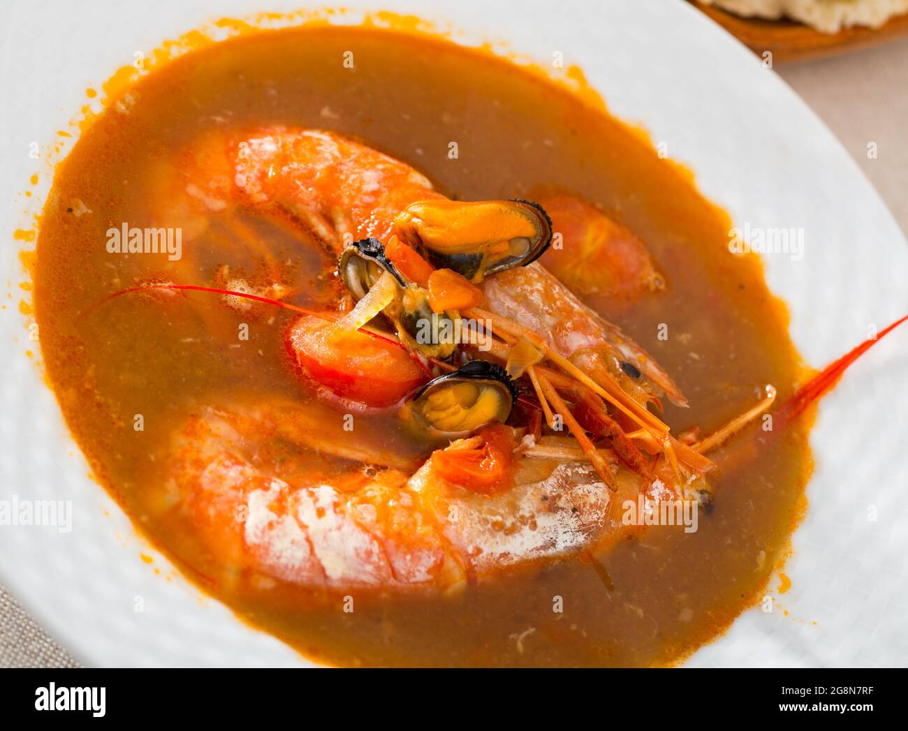 Spicy seafood soup with king prawns Stock Photo Alamy