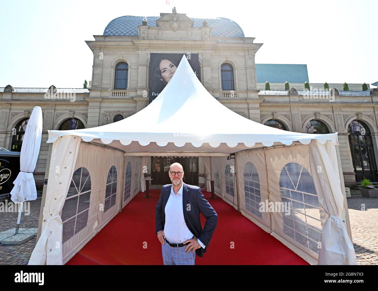 Baden Baden, Germany. 20th July, 2021. Benedikt Stampa, artistic director of the Festspielhaus Baden-Baden, stands in a tent in front of the opera house. To ensure safe distances even on rainy days, the Festspielhaus relies, among other things, on 'flying structures' to protect the audience. As part of a model project of 18 cultural and leisure facilities in Baden-Wuerttemberg, the Festspielhaus is testing the optimal management of visitor flows in times of pandemic. (to dpa-Korr 'Between frustration and euphoria: Festival bosses test what works') Credit: Uli Deck/dpa/Alamy Live News Stock Photo