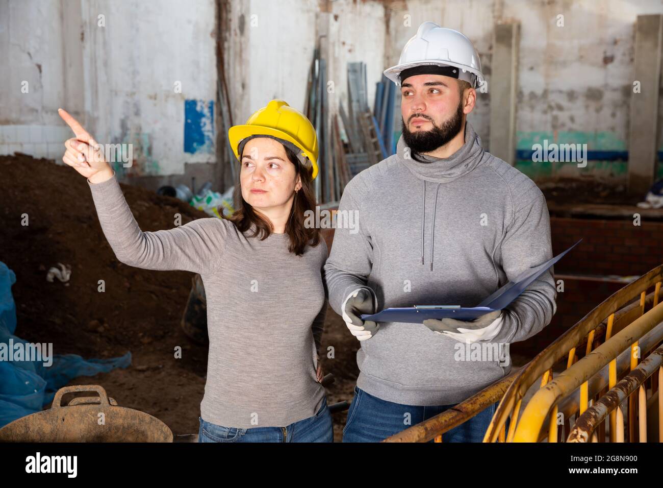 Architect and contractor discussing construction plan Stock Photo