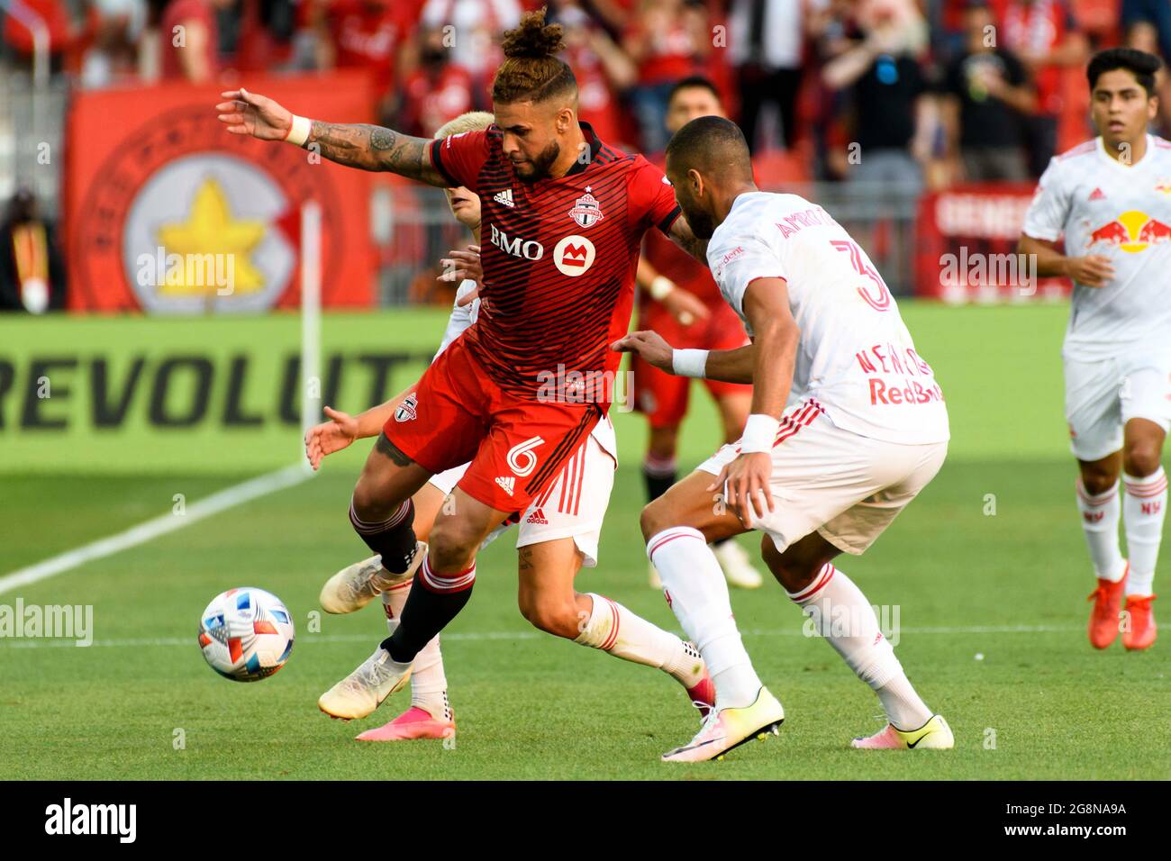 Toronto, Ontario, Canada. 21st July, 2021. Amro Tarek (3) and Dom Dwyer (6) in action during the MLS game between between Toronto FC and NY Red Bulls. The game ended 1-1 (Credit Image: © Angel Marchini/ZUMA Press Wire) Stock Photo