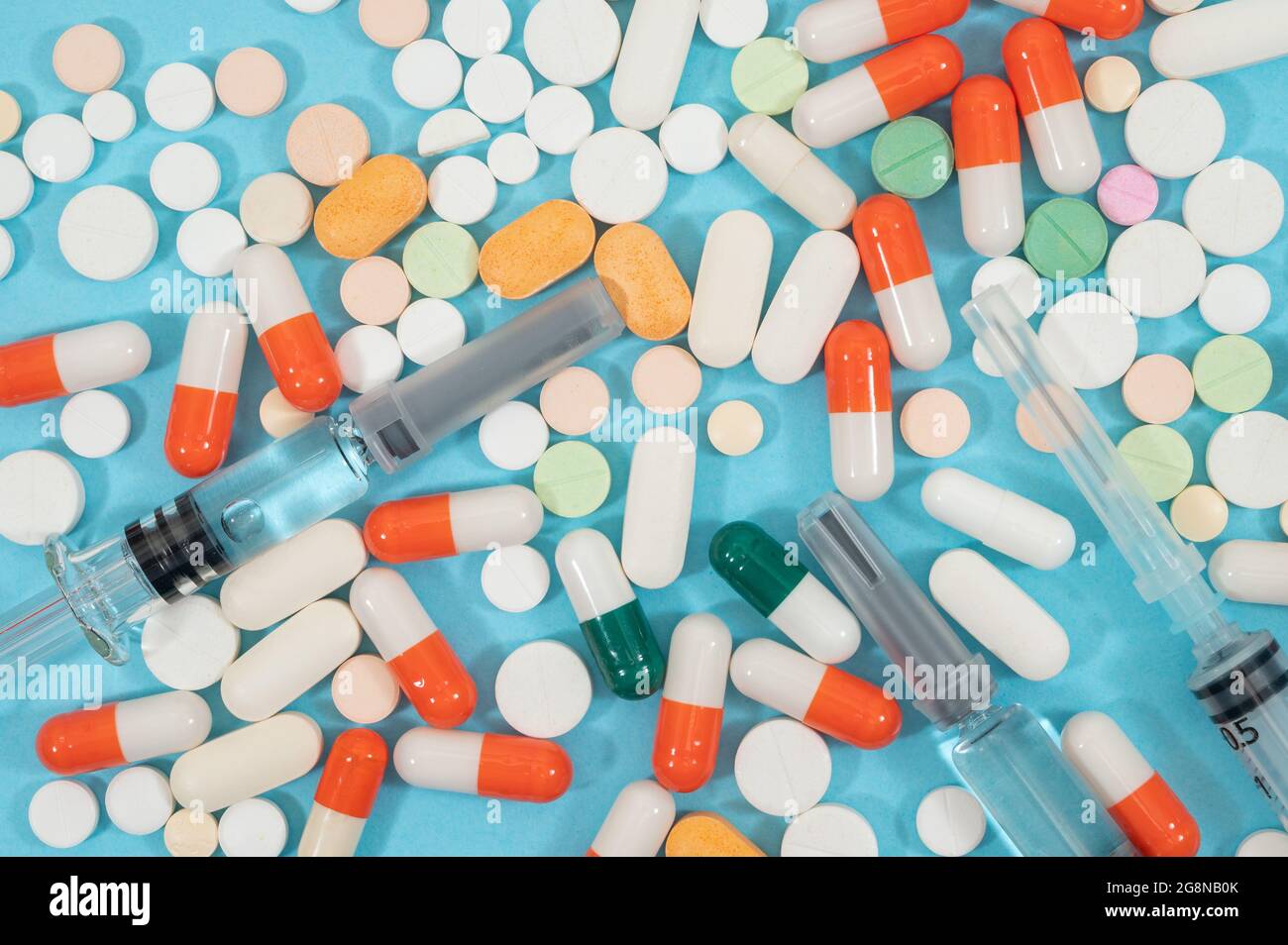 Medical concept with different types of medicines on blue background