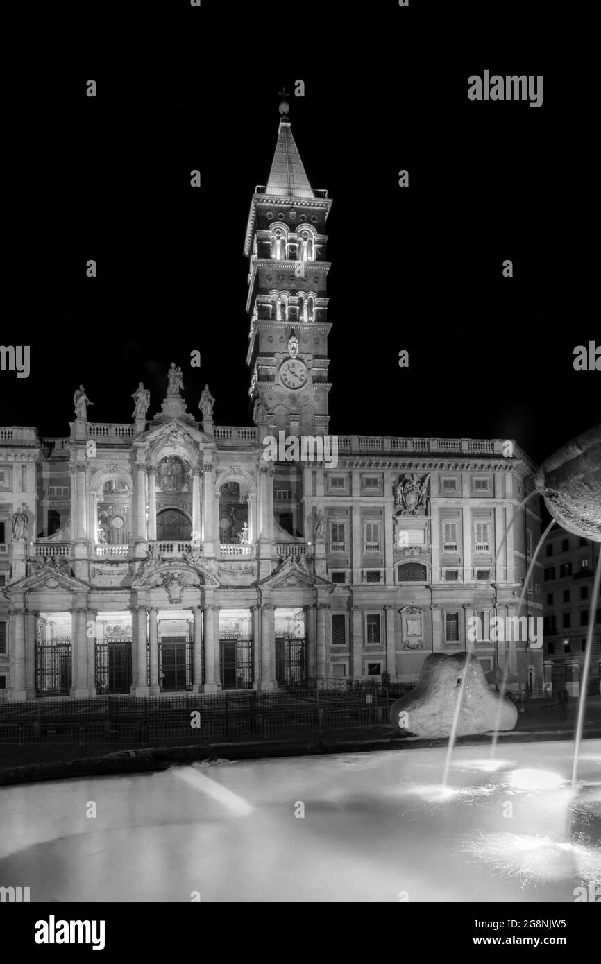 SANTA MARIA MAGGIORE cathedral in Rome, Italy. Black and white shot at night. Vertical poster Stock Photo