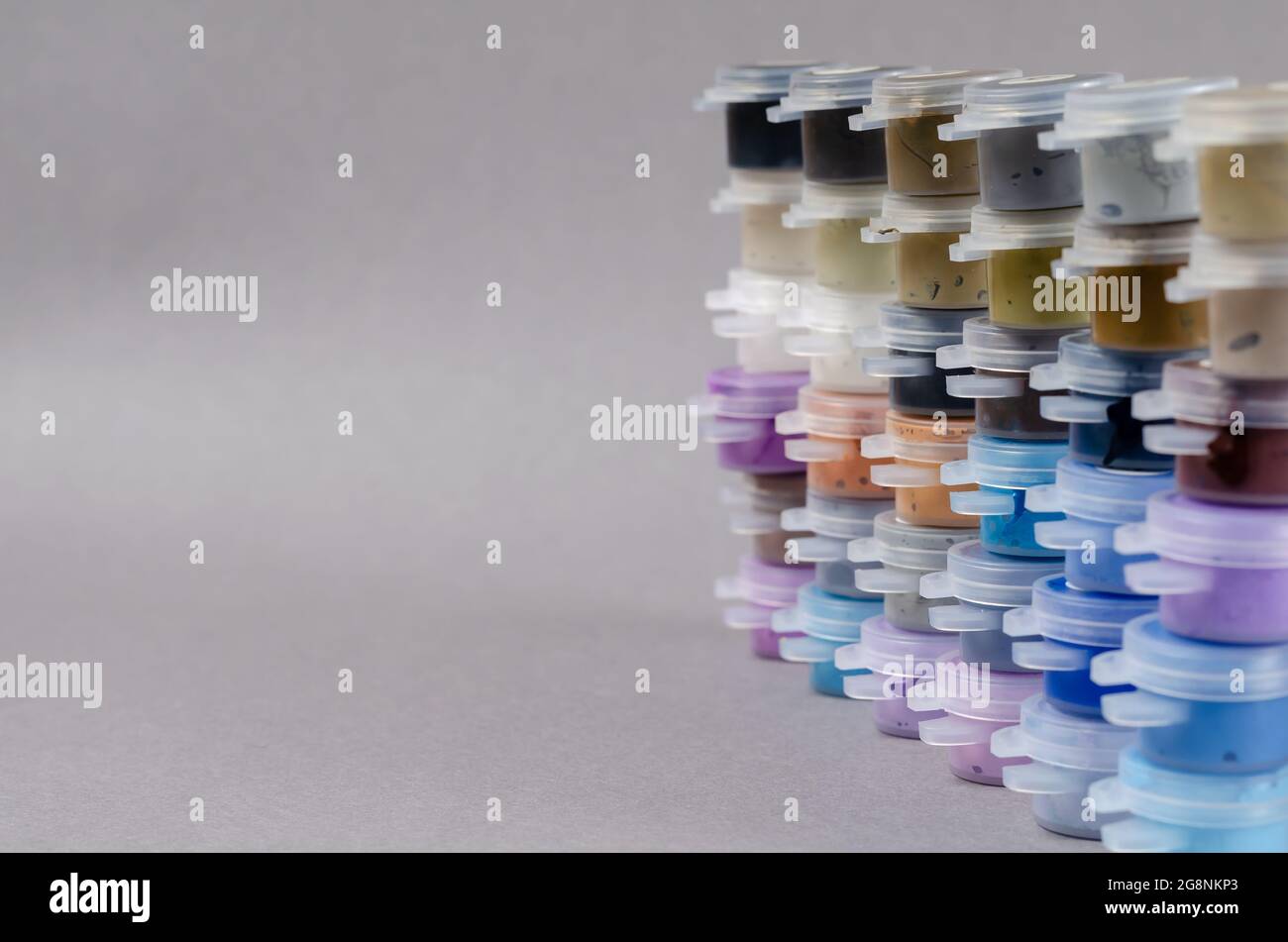 Numbered Plastic paint containers on Gainsboro color background. Set of