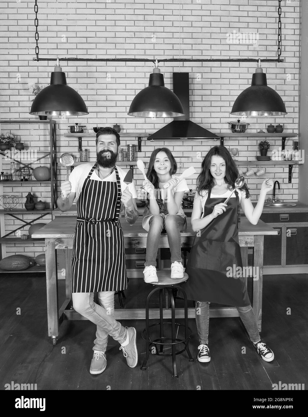 Happy family cooking holiday meals together, kitchen team concept Stock