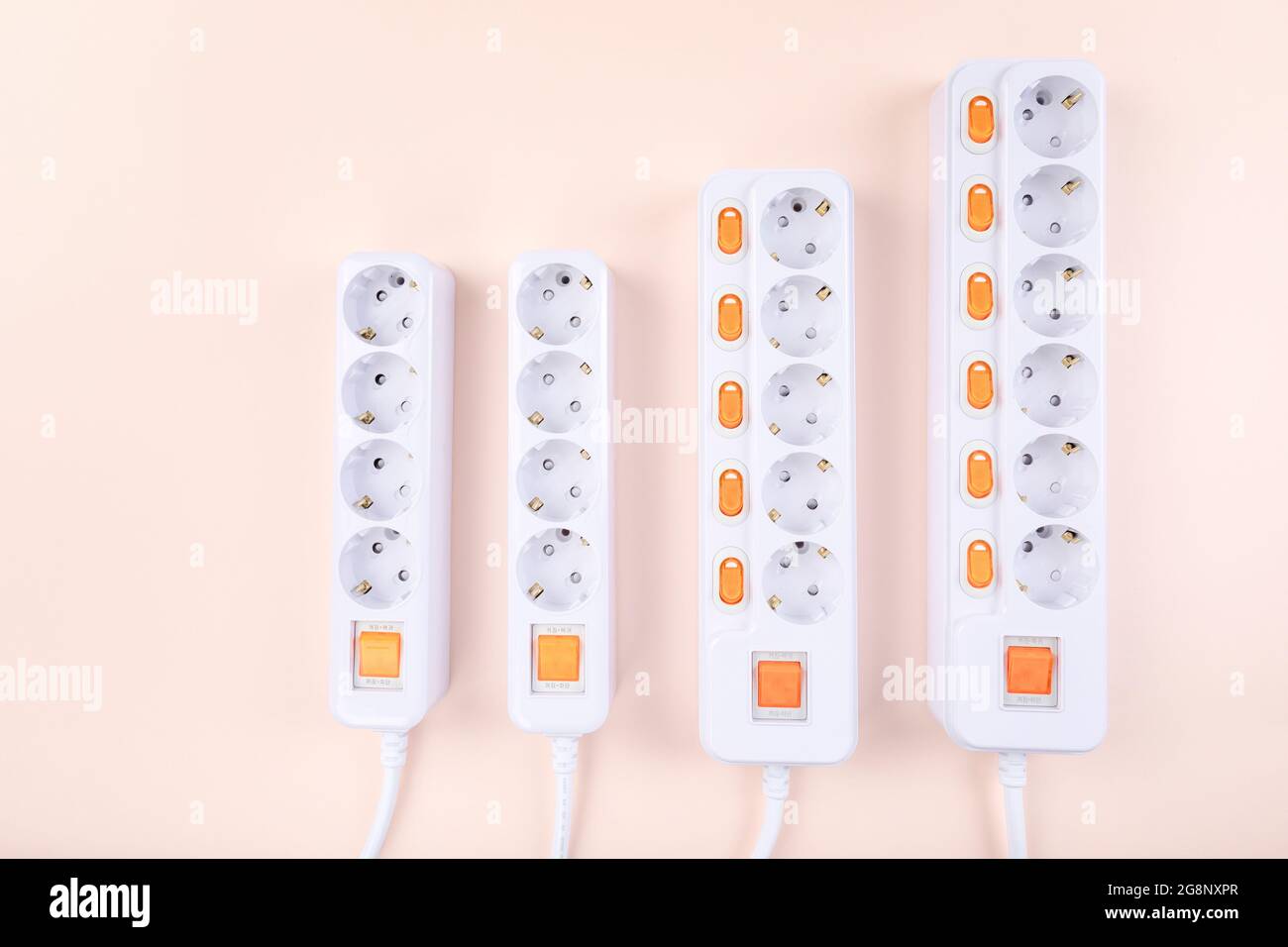 many power strips, pink background Stock Photo Alamy