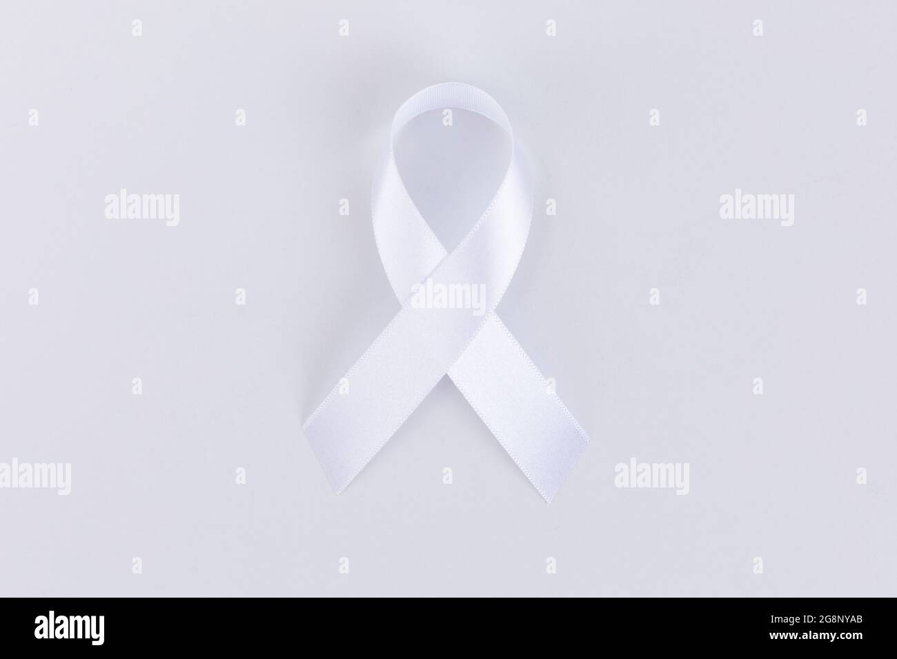 White ribbon on white background Stock Photo - Alamy