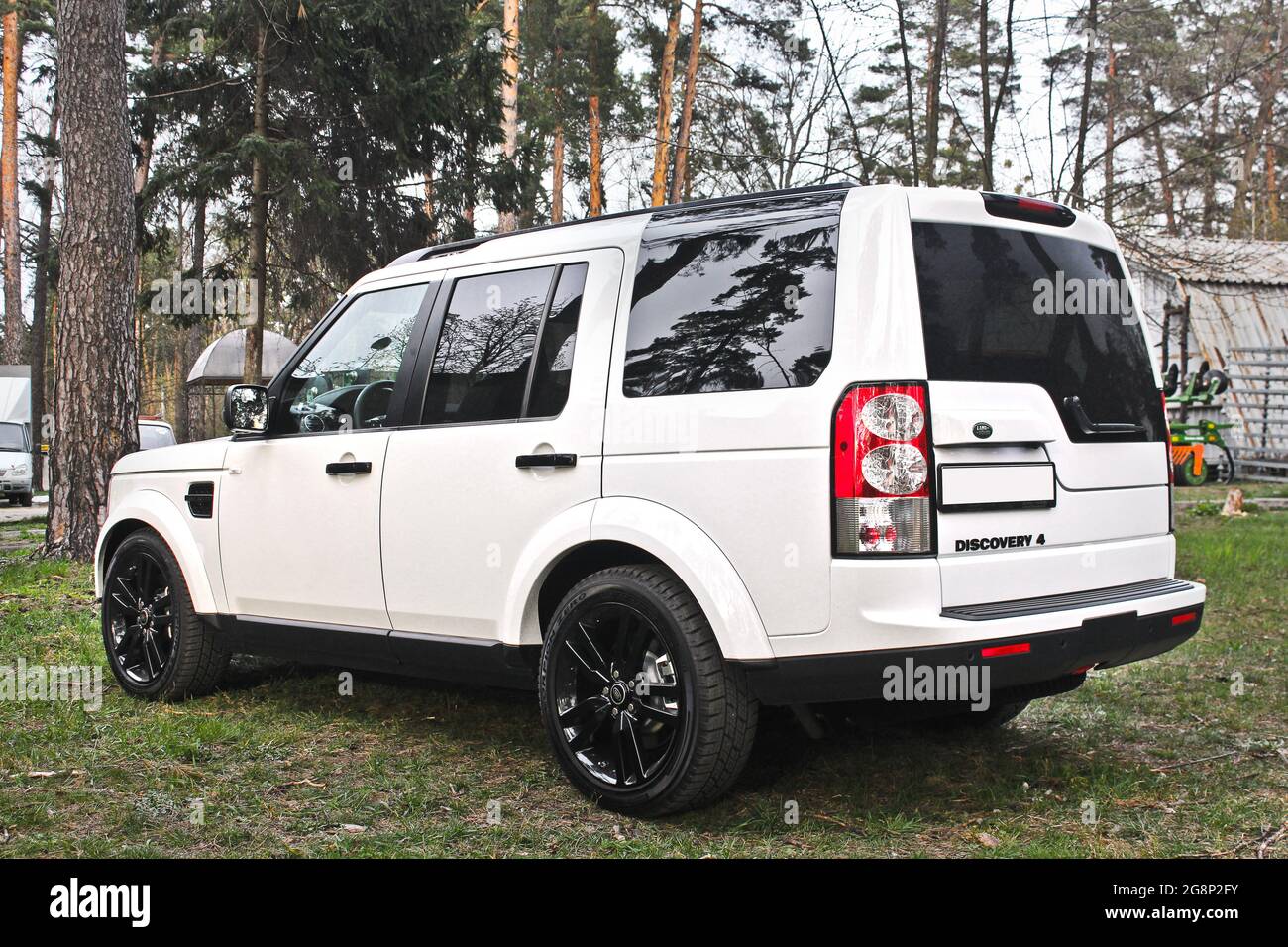 Kiev, Ukraine - April 20, 2016: White SUV Land Range Rover Discovery 4 in  the forest Stock Photo - Alamy