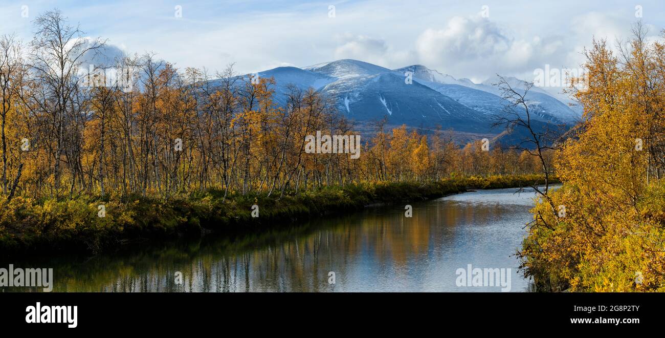 Rapa river in Sarek National Park in autumn, with fall colours and snowy mountains Stock Photo