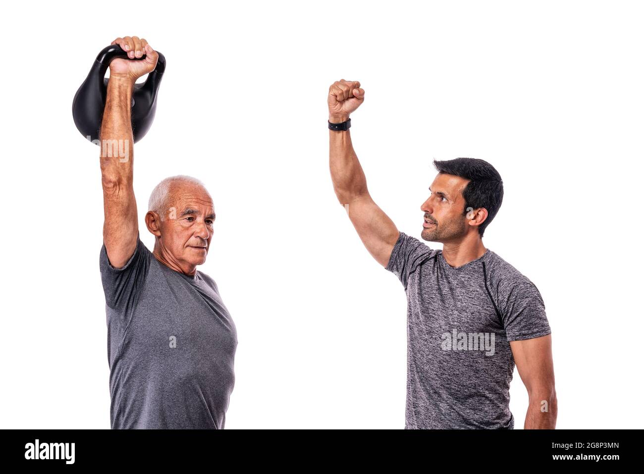 Old man with a middle-aged personal trainer is conducting a fitness workout. On an isolated white background. White background. Stock Photo
