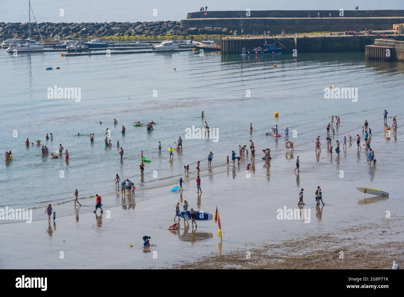 Lyme Regis, Dorset, UK. 22nd July, 2021. UK Weather Holiday makers