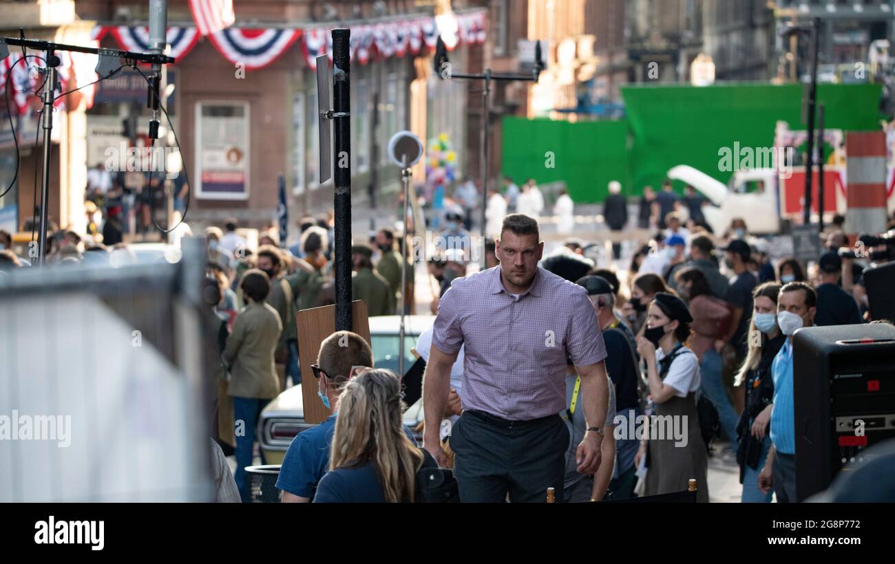 Glasgow, Scotland, UK. 21 July 2021.  PICTURED: Olivier Richters’ (AKA The Dutch Giant) seen dominating everyone on the film set taking a break in between takes. Filming on the set of Indiana Jones 5 in the middle of Glasgow city centre as the Hollywood blockbuster sets up Glasgow as New York City. Credit: Colin Fisher Stock Photo