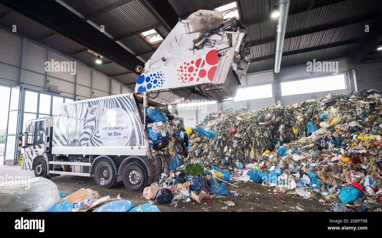 Hanover, Germany. 22nd July, 2021. A garbage truck dumps residual waste