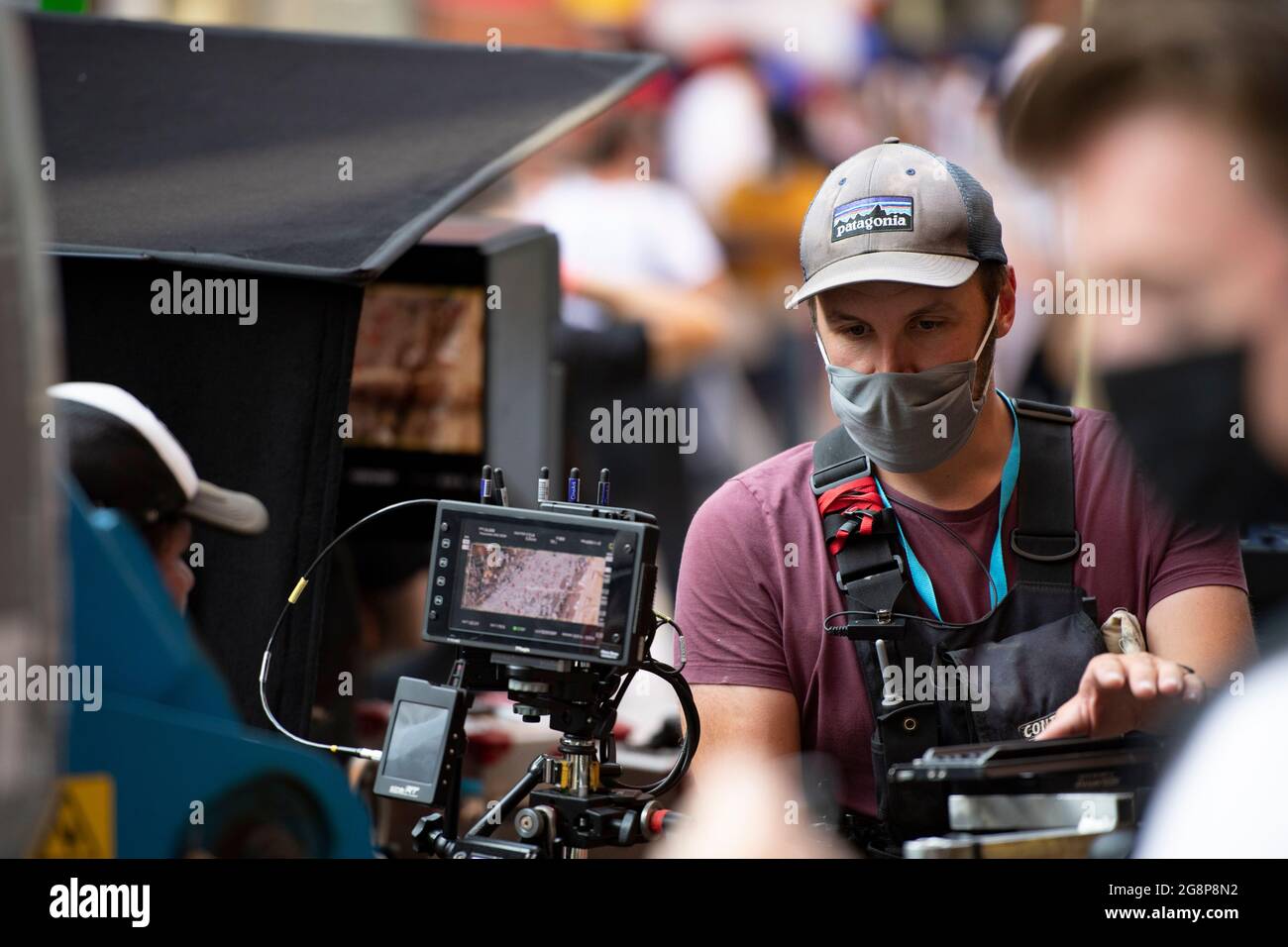 Glasgow, Scotland, UK. 21 July 2021. PICTURED: A sneek peek long lens view  of the directors monitor which is relaying aerial views from the camera  high above the street looking down onto