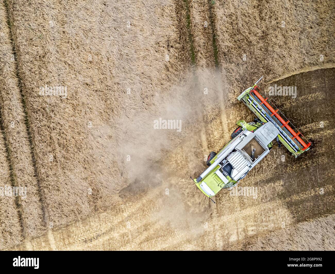 Grain harvest aerial view of a combine harvester Stock Photo - Alamy