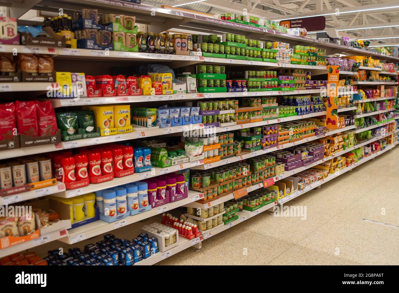 Taplow, Buckinghamshire, UK. 22 July, 2021. Despite reports in the press this morning, shelves in Sainsbury's Supermarket were generally very well stocked this morning. The main exception was for mineral water as people have been buying more than normal due to the heatwave. Following the Covid-19 lockdown lifting on Monday, Sainsbury's have new signs outside their store asking customers to wear masks if they can. Credit: Maureen McLean/Alamy Live News Stock Photo