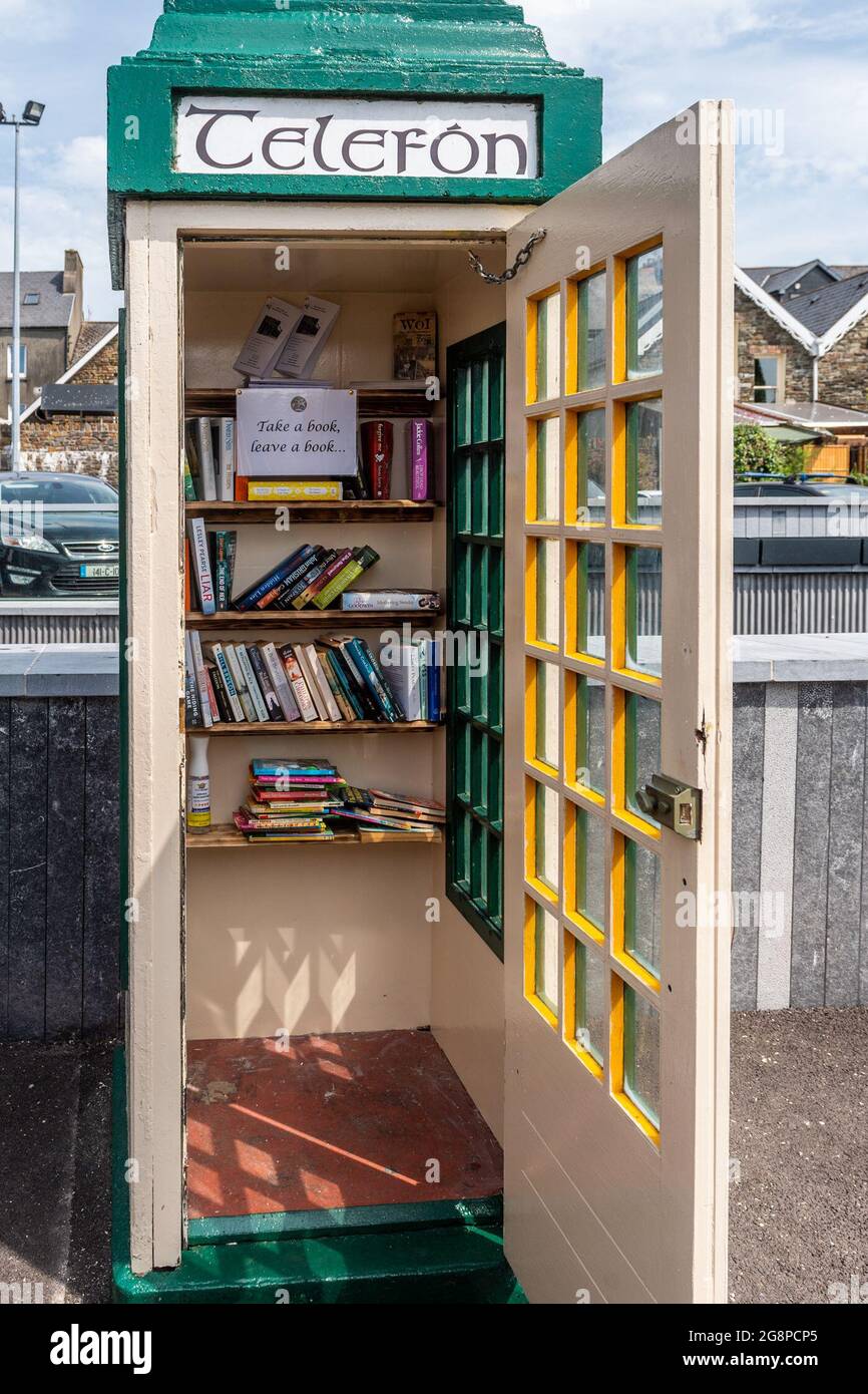Clonakilty, West Cork, Ireland. 22nd July, 2021. An old phone box on Kent Street in Clonakilty has been turned into a 'Take a Book, Leave a Book' initiative. Credit: AG News/Alamy Live News Stock Photo