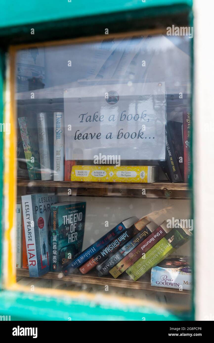 Clonakilty, West Cork, Ireland. 22nd July, 2021. An old phone box on Kent Street in Clonakilty has been turned into a 'Take a Book, Leave a Book' initiative. Credit: AG News/Alamy Live News Stock Photo