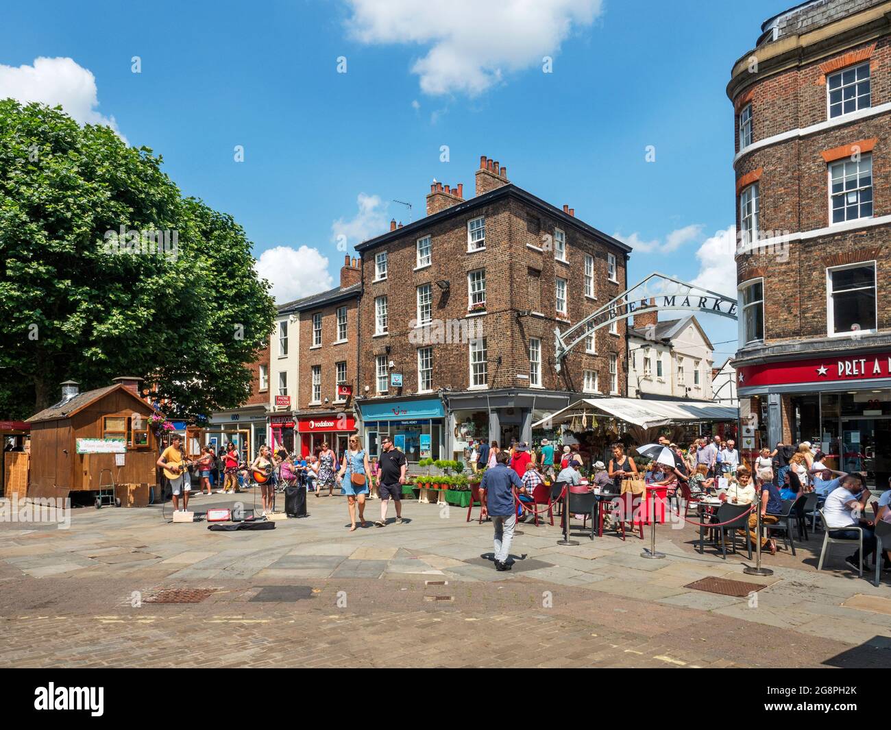 Busy Parliament Street and entrance to Shambles Market on a summer day in York Yorkshire England Stock Photo
