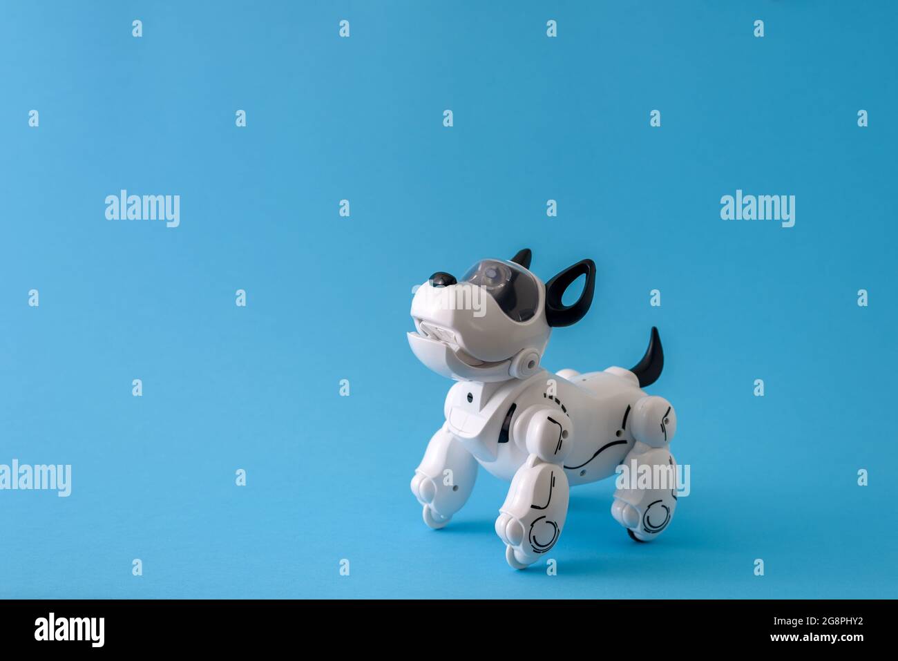 Robot dog pet on light blue background Stock Photo