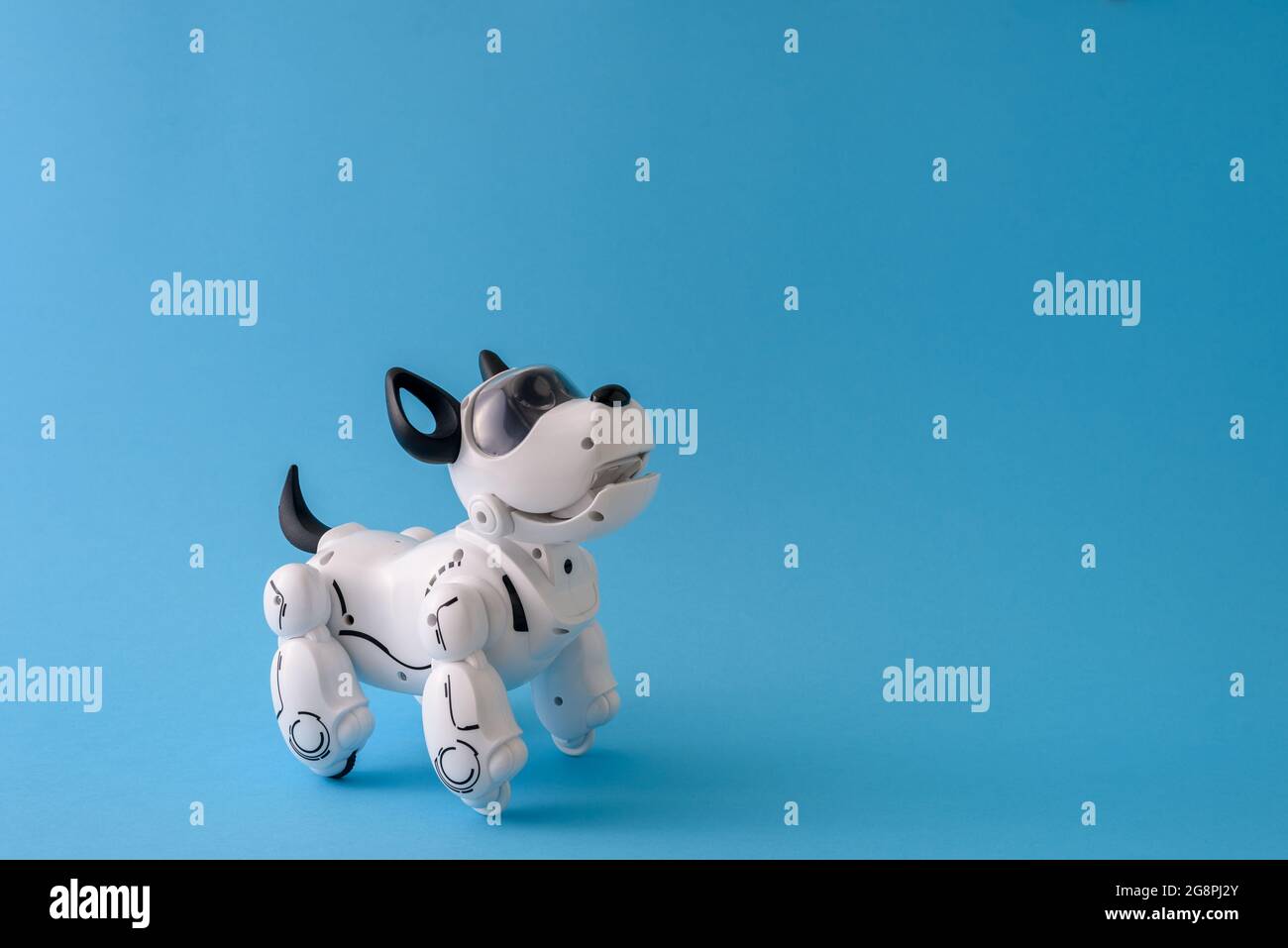 Robot dog pet on light blue background Stock Photo