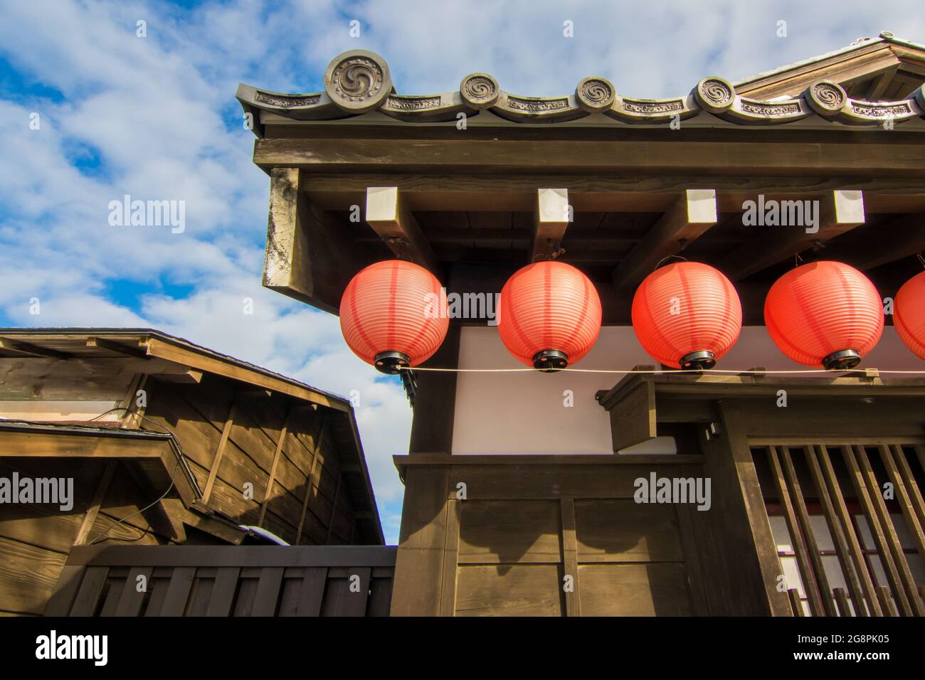 A red lantern hanging on Japanese roof Stock Photo