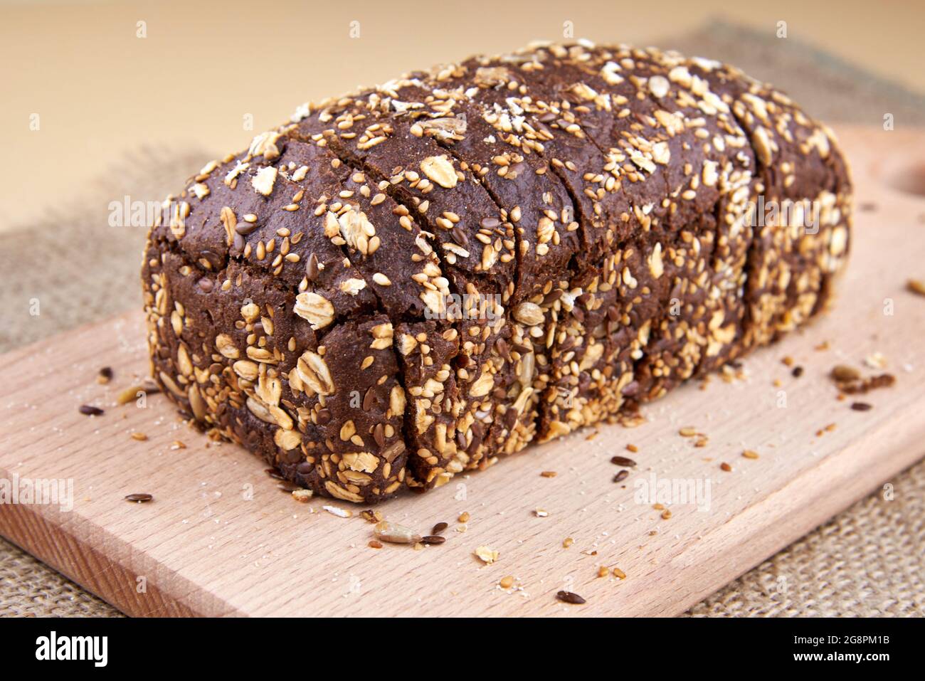 Dark rye bread with whole sunflower seeds, flaxseeds and oatmeal on top