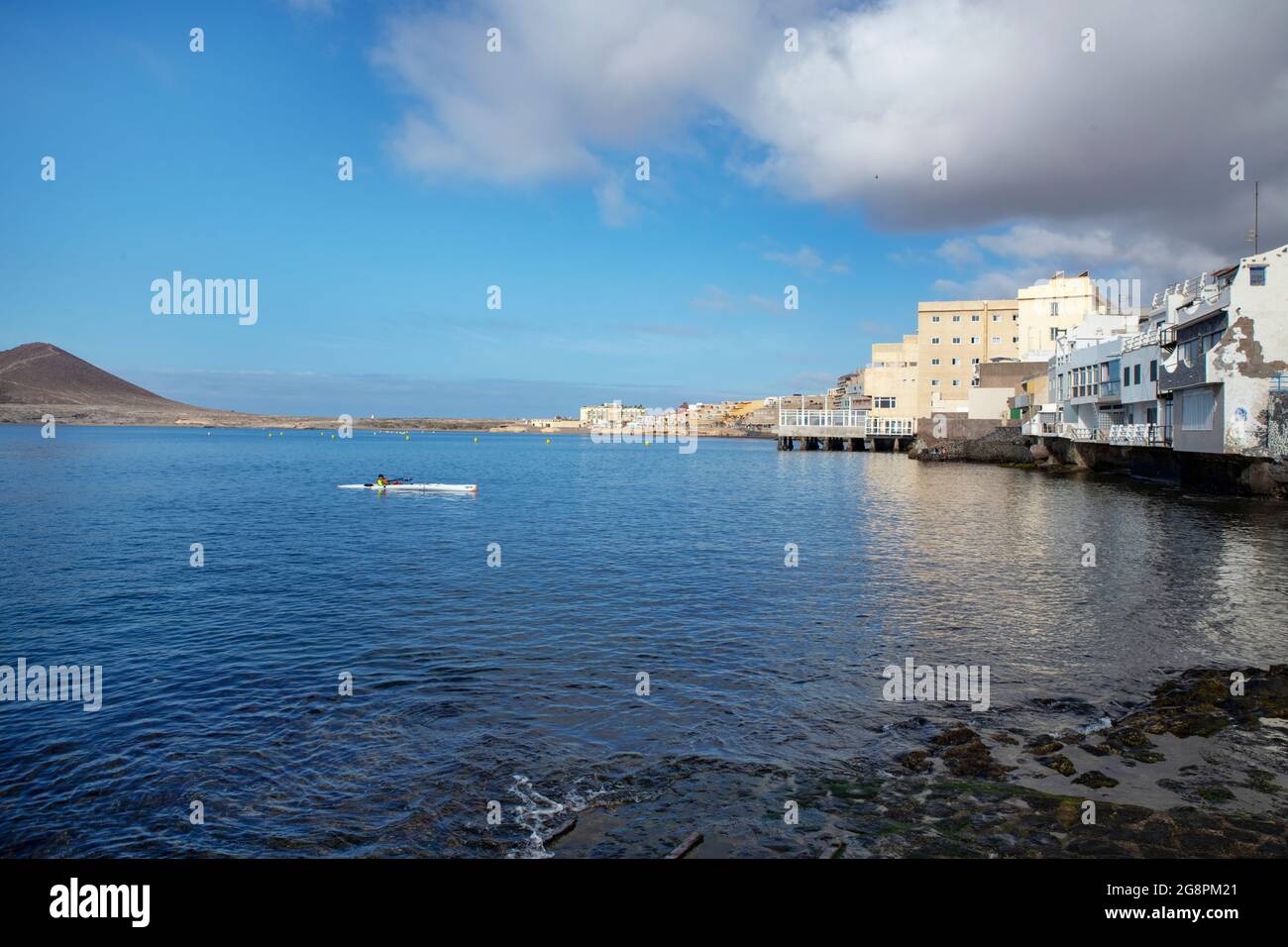 El Medano tranquil shore of the picturesque Canarian town popular for its annual watersports competitions, traditional cuisine and bohemian atmosphere Stock Photo