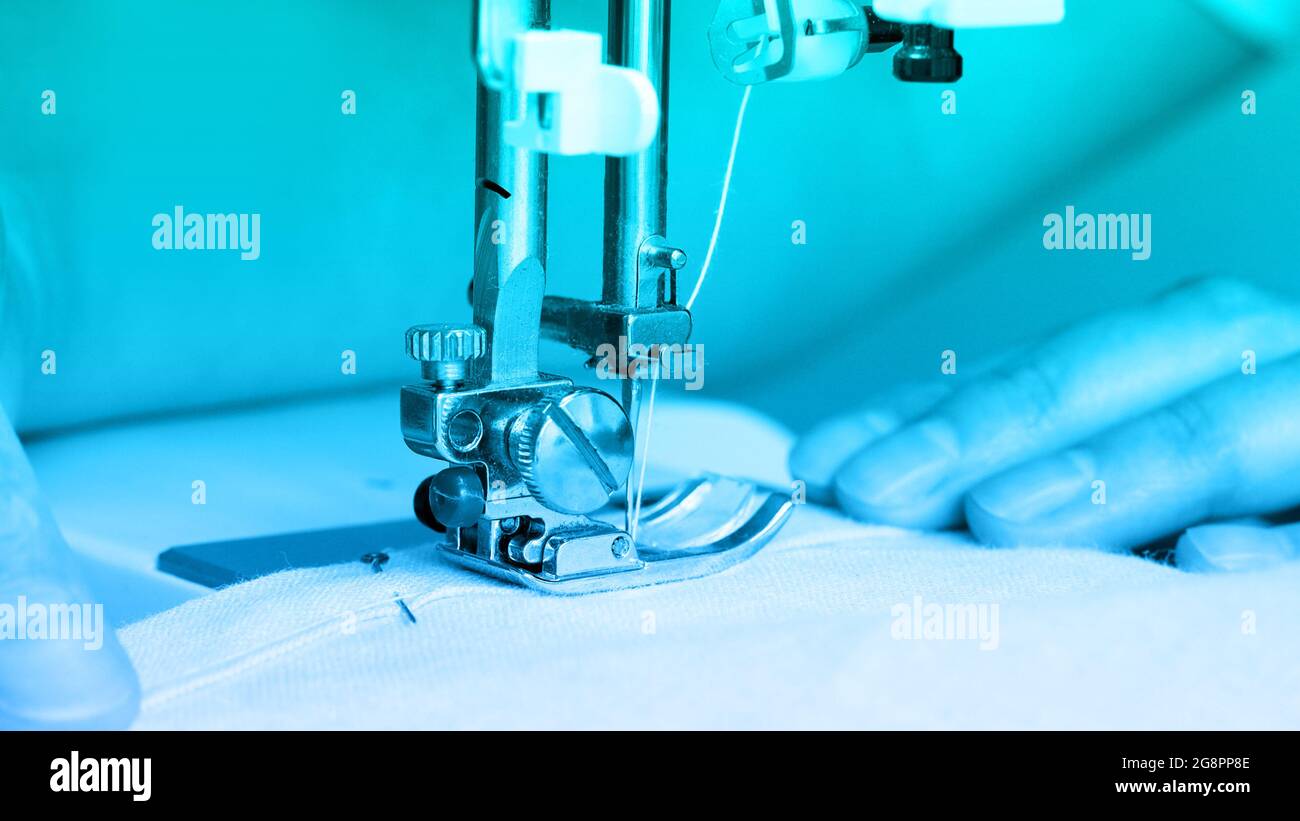 Close up mechanism of sewing machine foot with needle and thread Stock ...