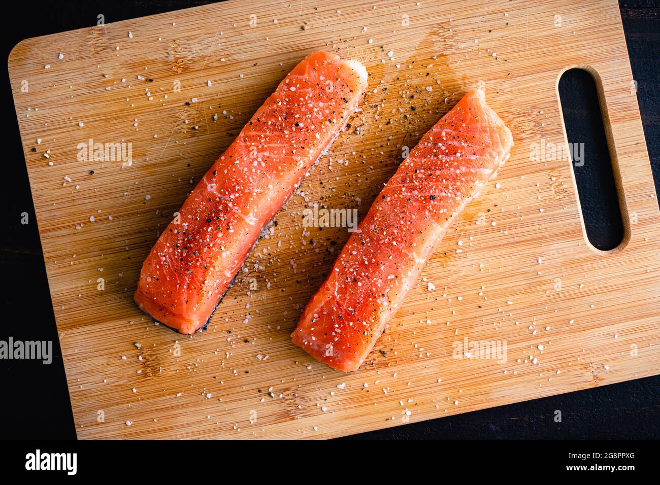 Raw Salmon Fillets Seasoned with Kosher Salt and Black Pepper Uncooked
