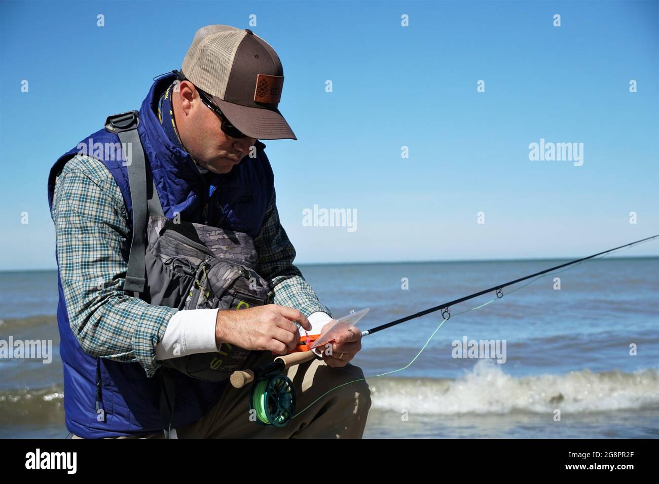 Selecting fly pattern for fly fishing Stock Photo