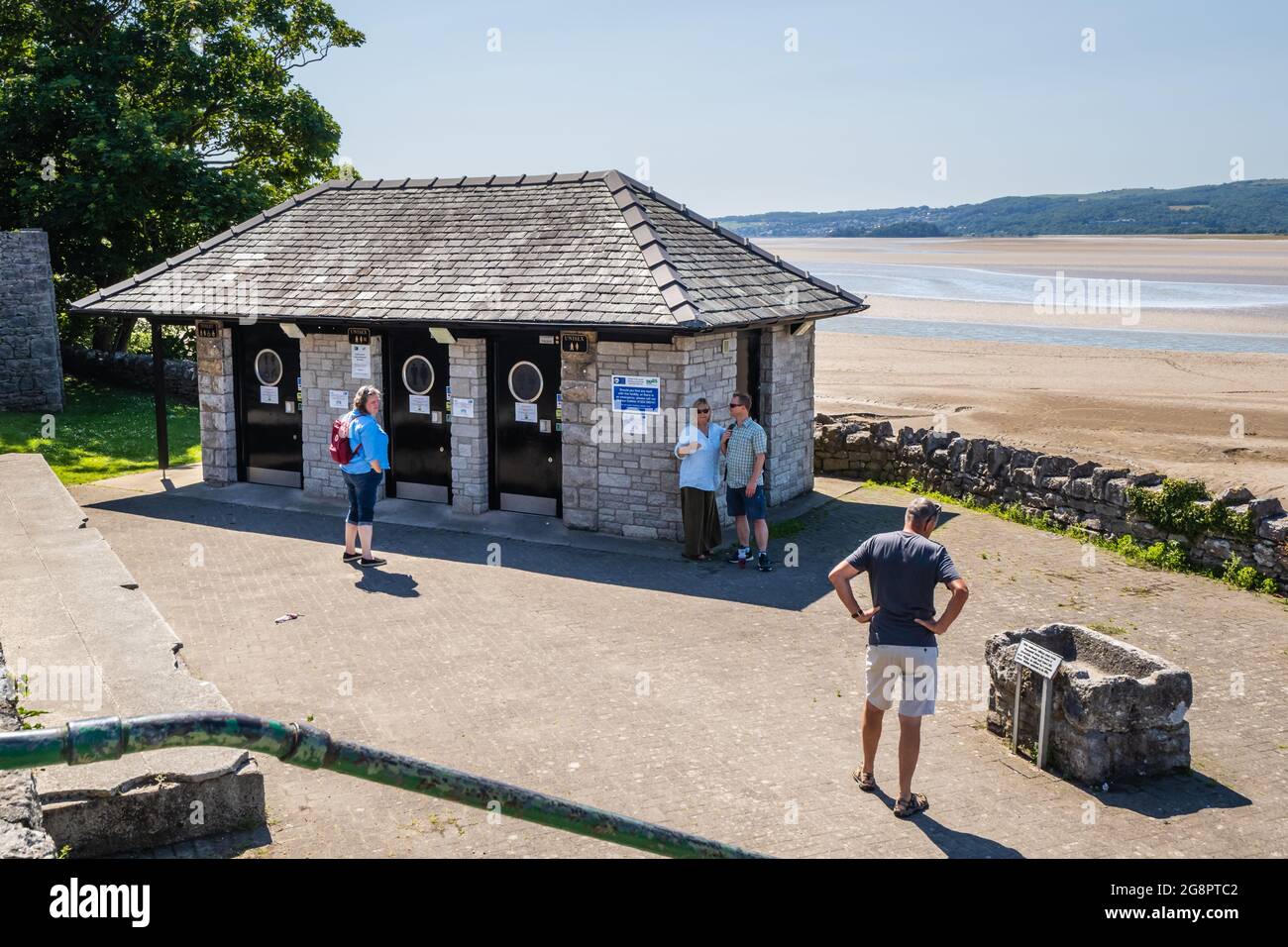 16.07.21 Arnside, Lancashire, UK People waiting to use public toilets in Arnside in Lancashire on a hot summers day Stock Photo