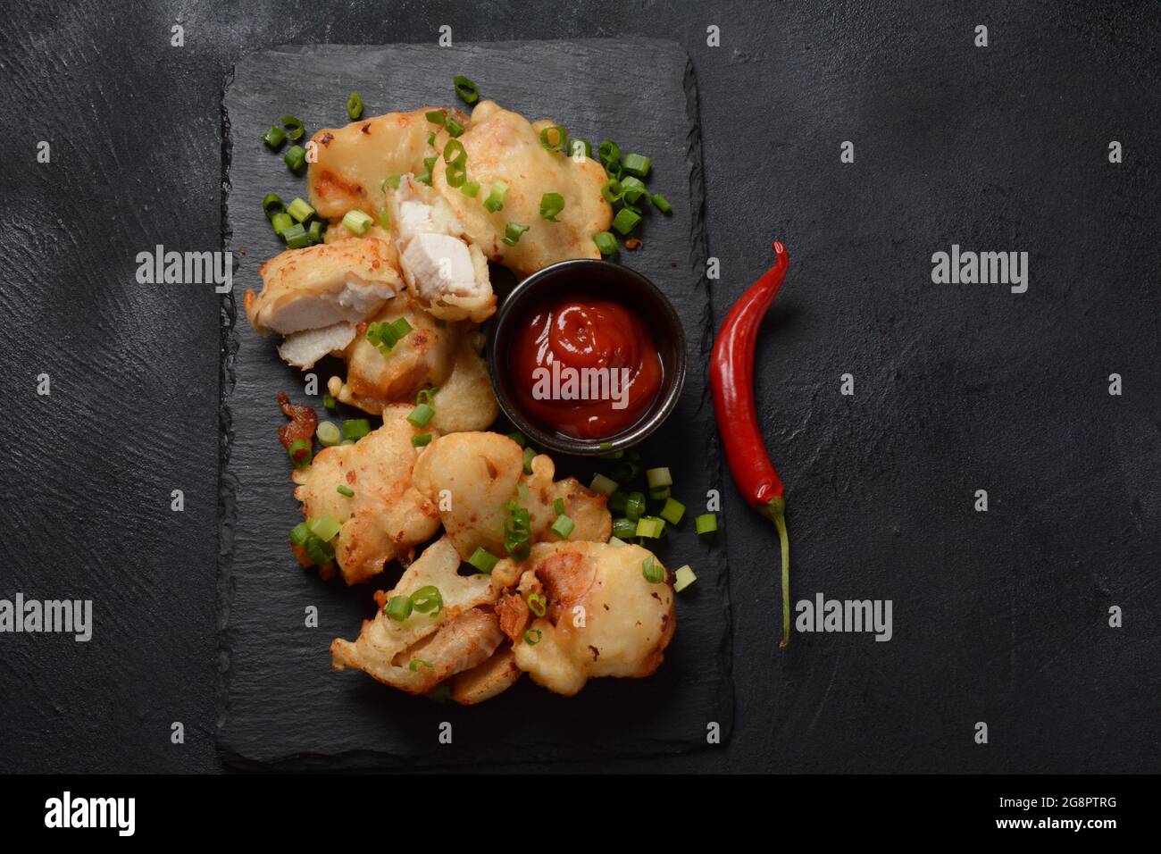 Golden crispy fried chicken fillet. Fried chicken pieces lightly battered, deep fried food Stock